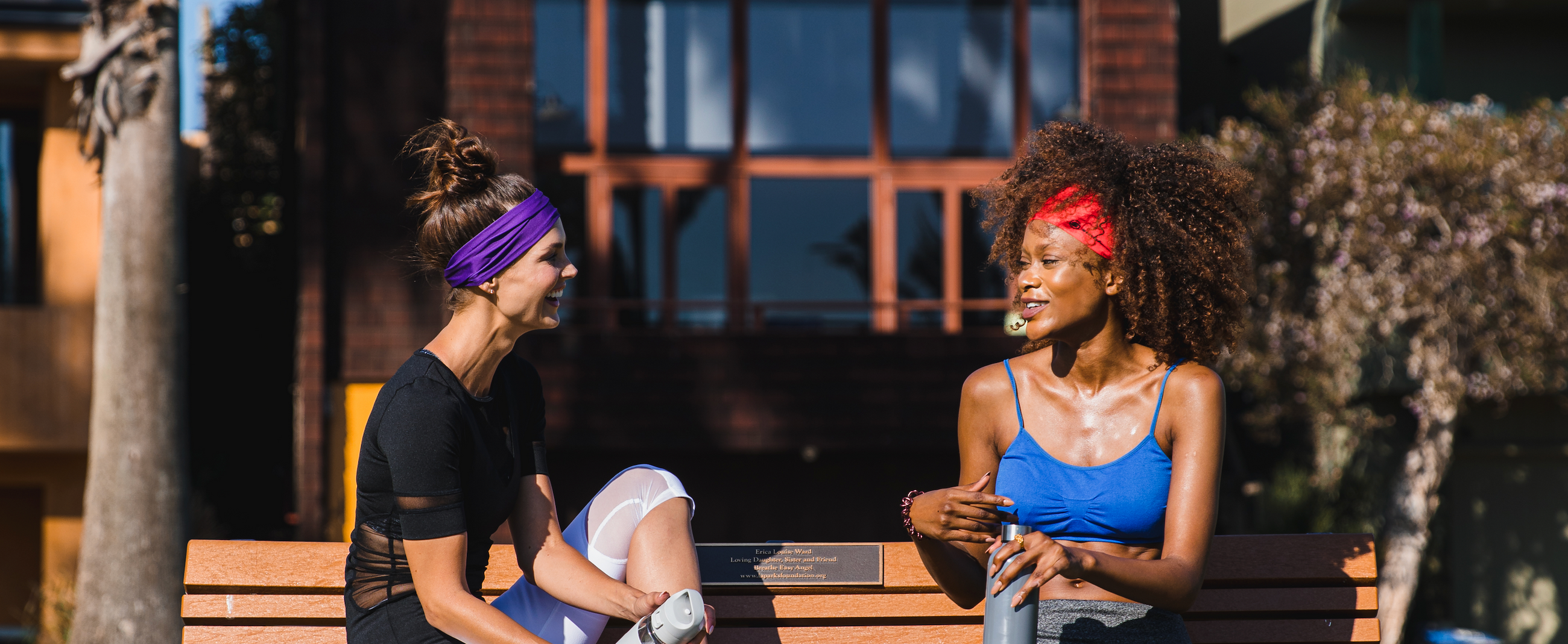 Couple wearing Suddora tapered headbands. These headbands are great for sports, fashion and wearing in the sun.