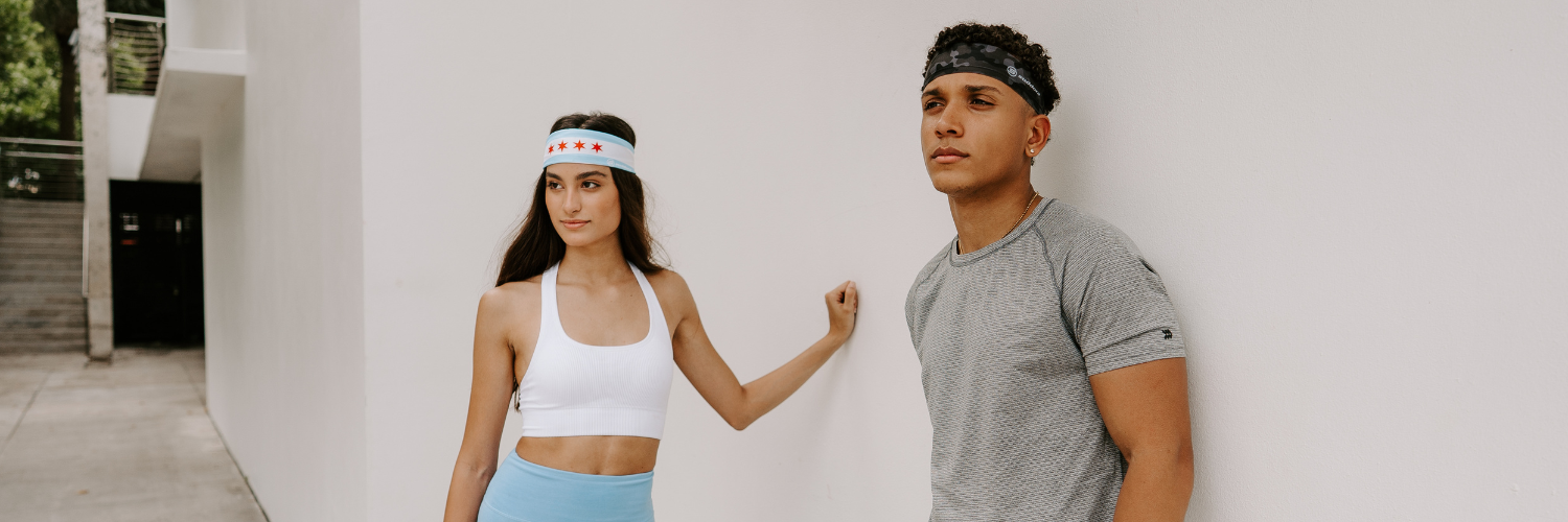 Couple wearing Suddora tapered headbands. These headbands are great for sports, fashion and wearing in the sun.